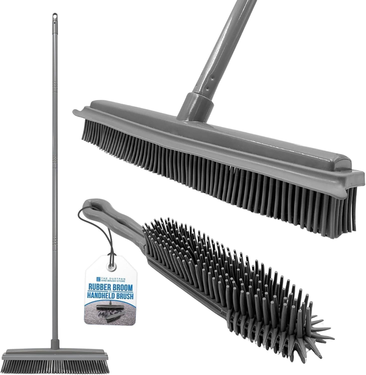 Grey rubber broom and handheld brush cleaning tools with long metal handles, shown on a white background with a hanging product tag.