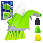 A bright green and gray manual floor grout cleaning brush set with a clear plastic container, shown alongside its blue retail packaging and three interchangeable sponge heads in black, green, and yellow on a white background.