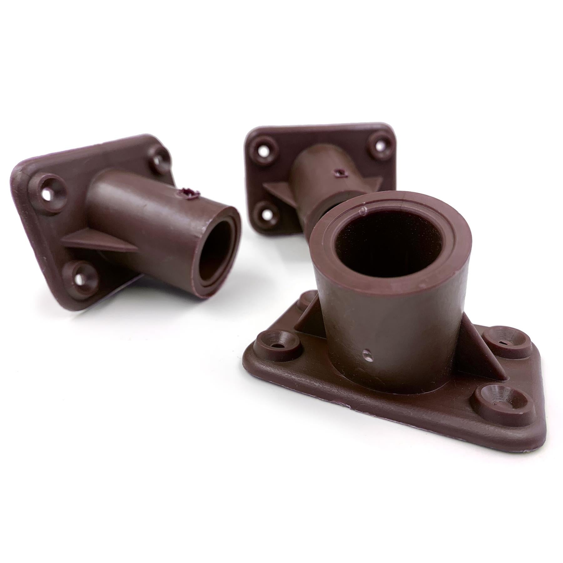 Three dark brown plastic mounting brackets or pipe couplers shown on a plain white background.