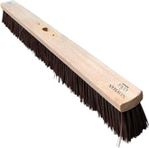 Long-handled brush with wooden handle and bristles on a white background