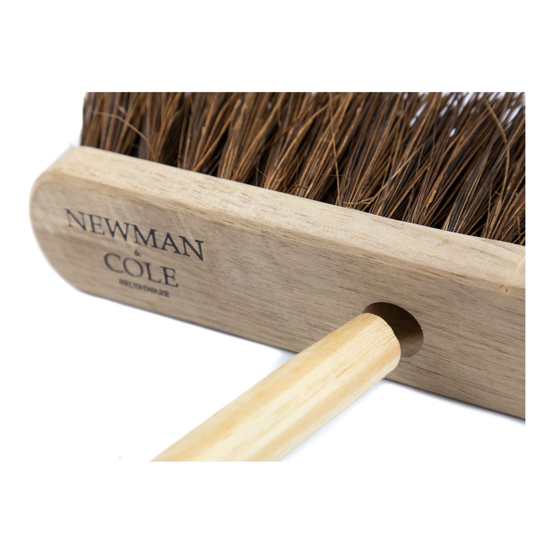 Close up shot of how broom handle fits into the 12" Newman & Cole Bassine Broom head