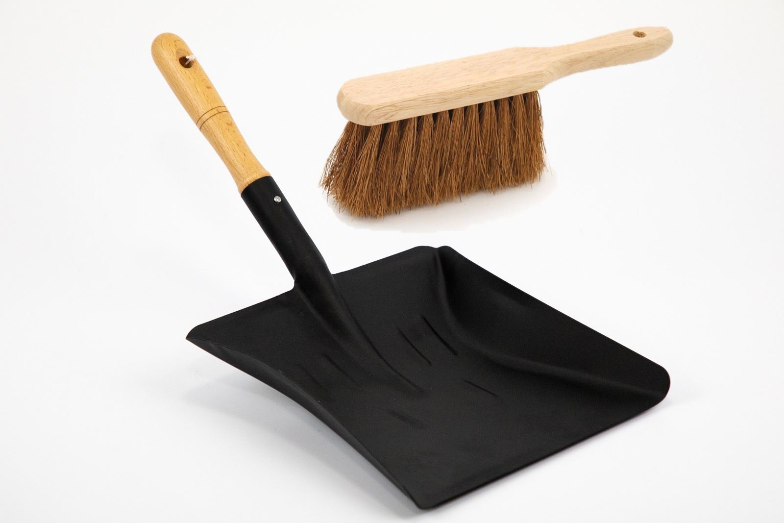 Black dustpan with wooden handle and brush on a white background