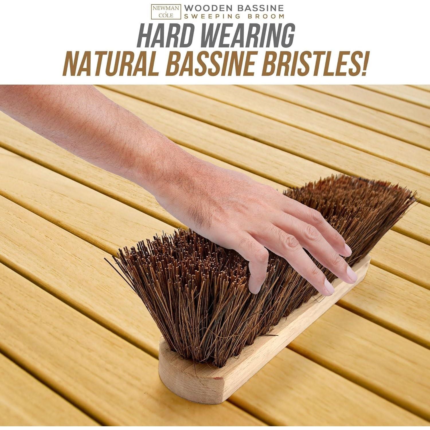 Shot focused on the stiff bassine bristles - hand touching them with text saying 'hard wearing natural bassine bristles'