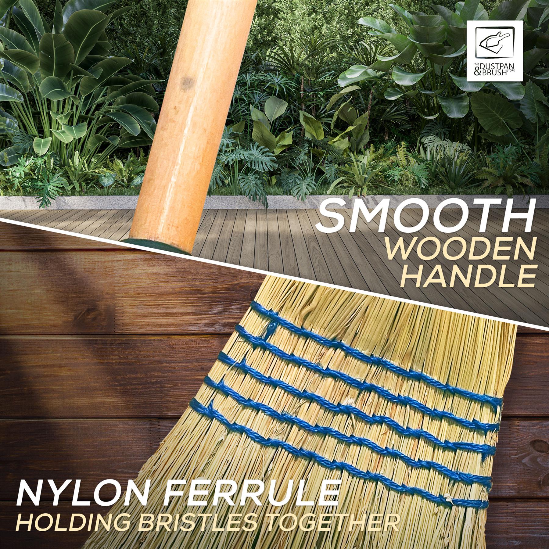 A close-up product shot of a broom head with natural straw-colored nylon bristles held together by blue bands and a smooth wooden handle, shown against a wooden deck and green foliage background with text overlays reading 'SMOOTH WOODEN HANDLE' and 'NYLON FERRULE HOLDING BRISTLES TOGETHER.'.