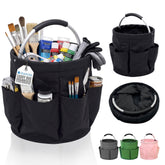 Black artist/crafty storage caddy bag with multiple front pockets, shown filled with paintbrushes, gloves, paint tubes, and other supplies. The image also includes smaller views of the empty bag in black, green, and pink on a white background.