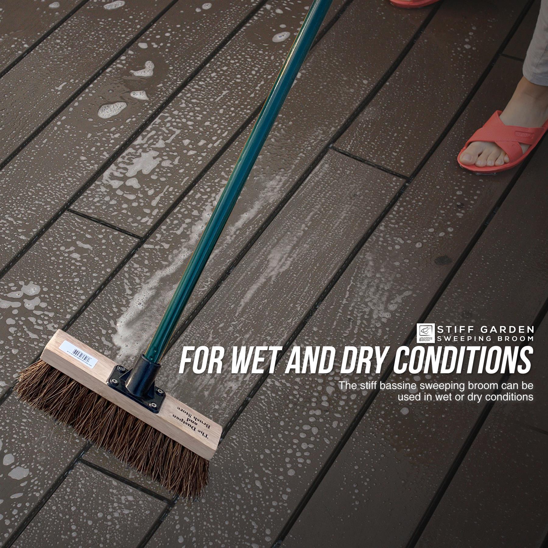 Environmental image of lady using the 10" Stiff Bassine Broom with Metal Handle – Outdoor Yard Brush to clean her patio
