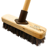 Wooden brush with bristles on a white background