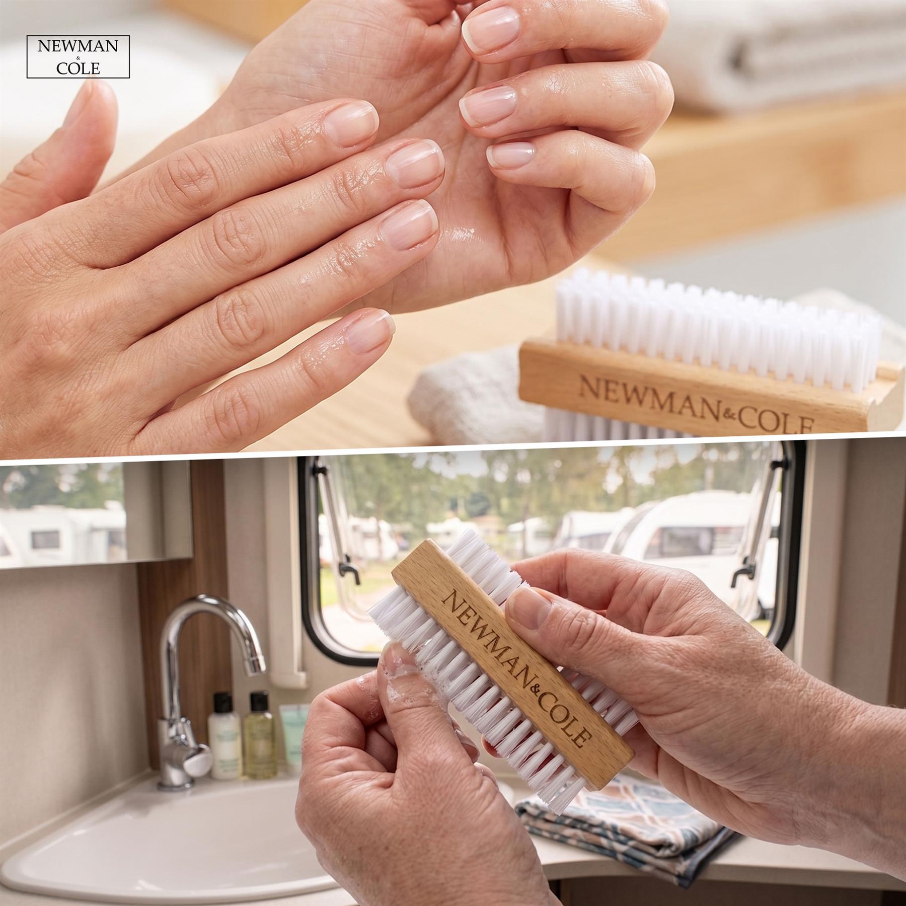 Newman & Cole nail brush being used on a hand with a sink and window in the background.
