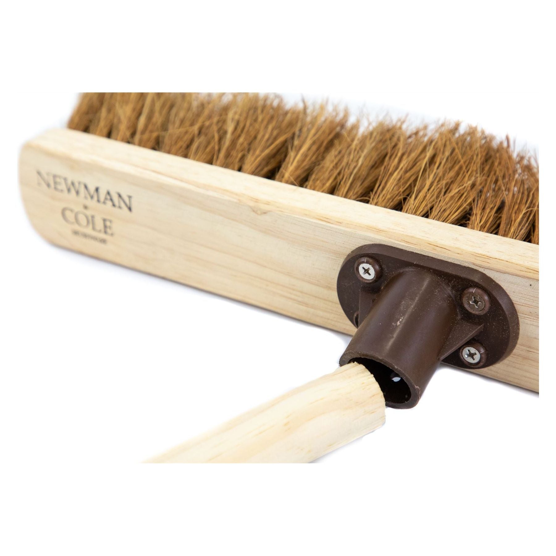 Example image of how a handle fits into the 18" Newman and Cole Natural Soft Coco Broom Head with Plastic Socket -On a white background