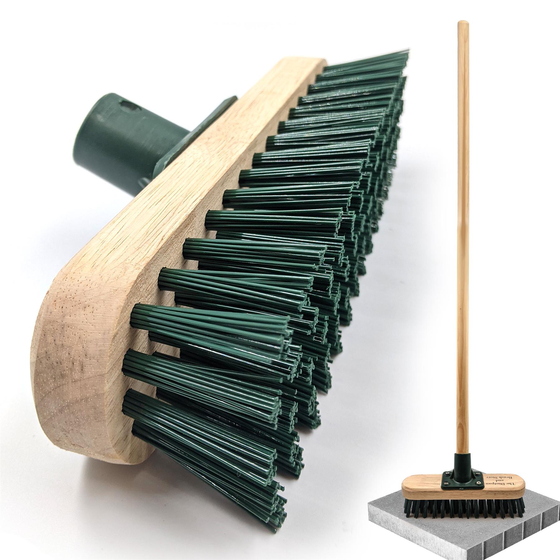 Cleaning brush with green bristles on a white background