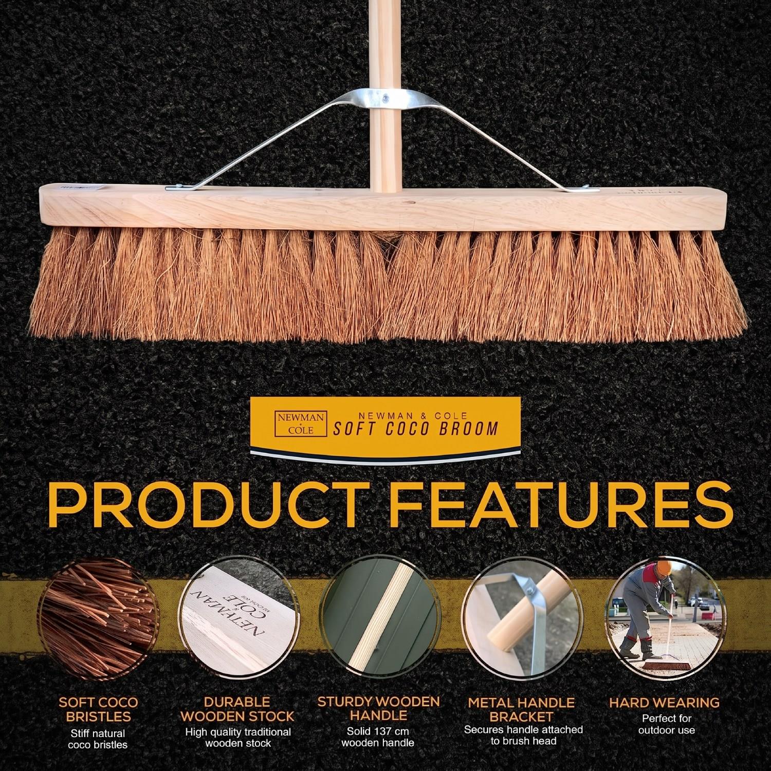 A wood-handled soft broom with natural tan bristles shown against a dark carpet background, with overlaid text reading 'Product Features' and feature callouts for soft coco bristles, durable wooden stock, sturdy wooden handle, metal handle bracket, and hard wearing.