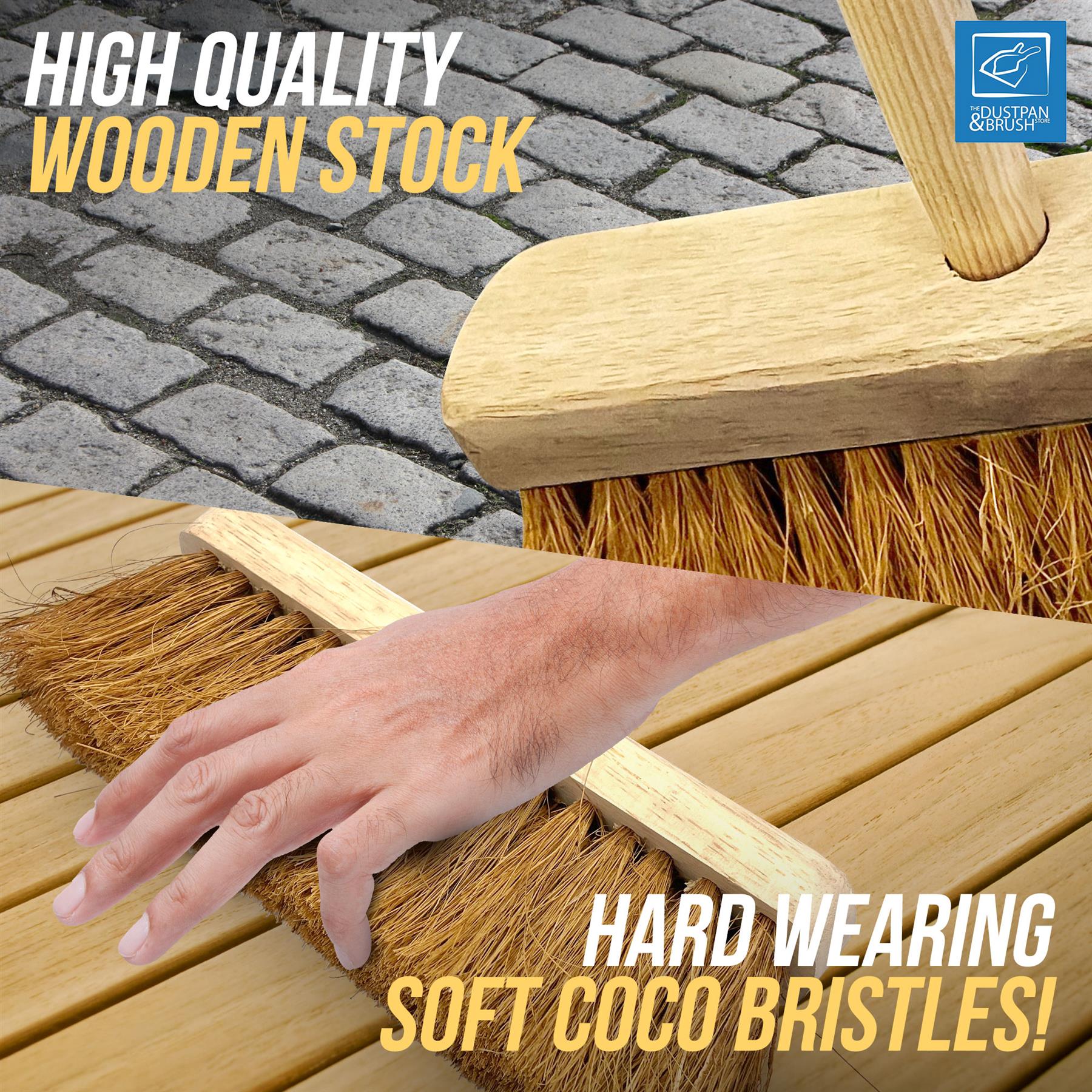 A close-up promotional shot of a wooden broom with soft coco bristles being swept across a light wood surface, with a human hand resting on the bristles for scale. Text overlays read 'HIGH QUALITY WOODEN STOCK' and 'HARD WEARING SOFT COCO BRISTLES!'