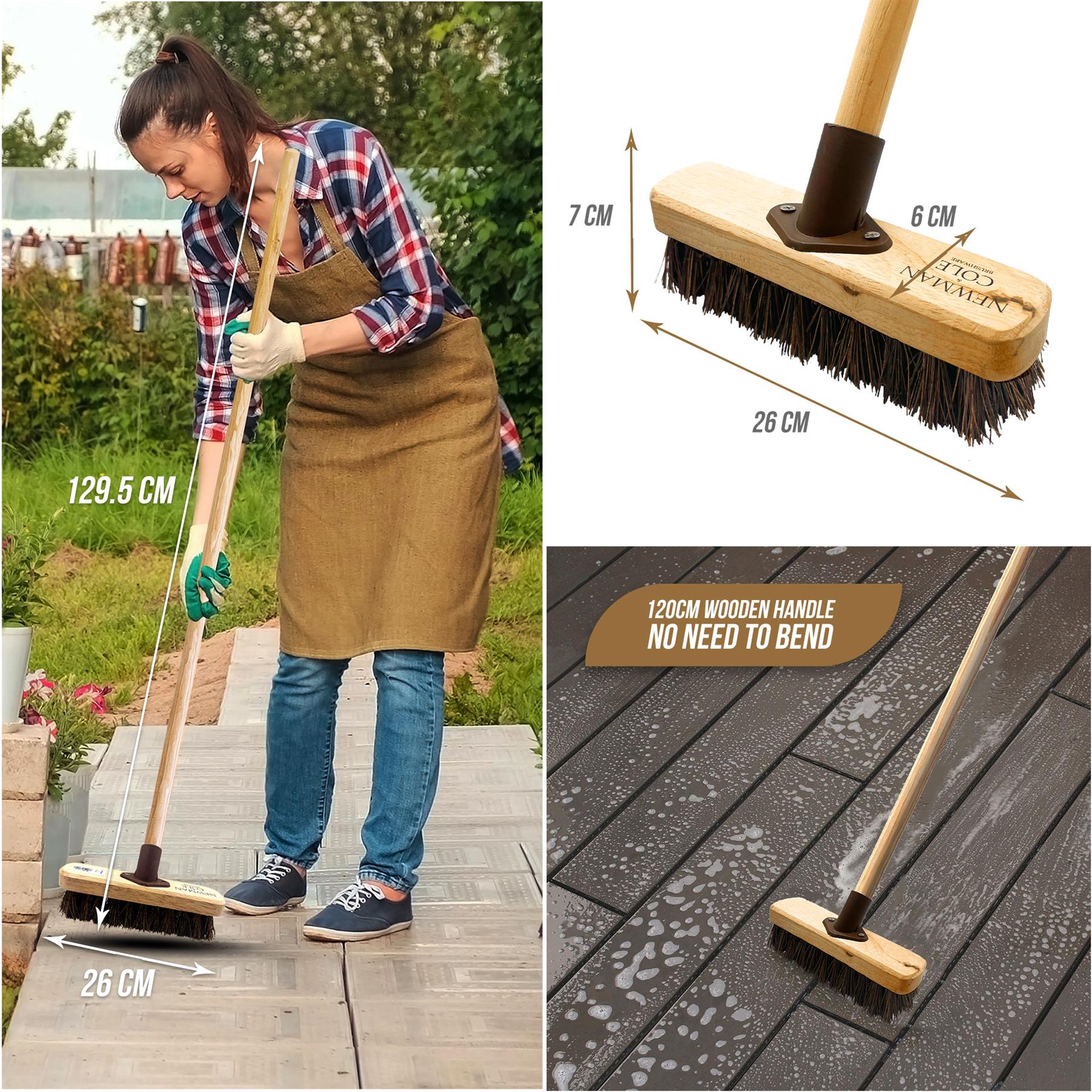 Woman using a broom outdoors with measurements and product details on a wooden surface.