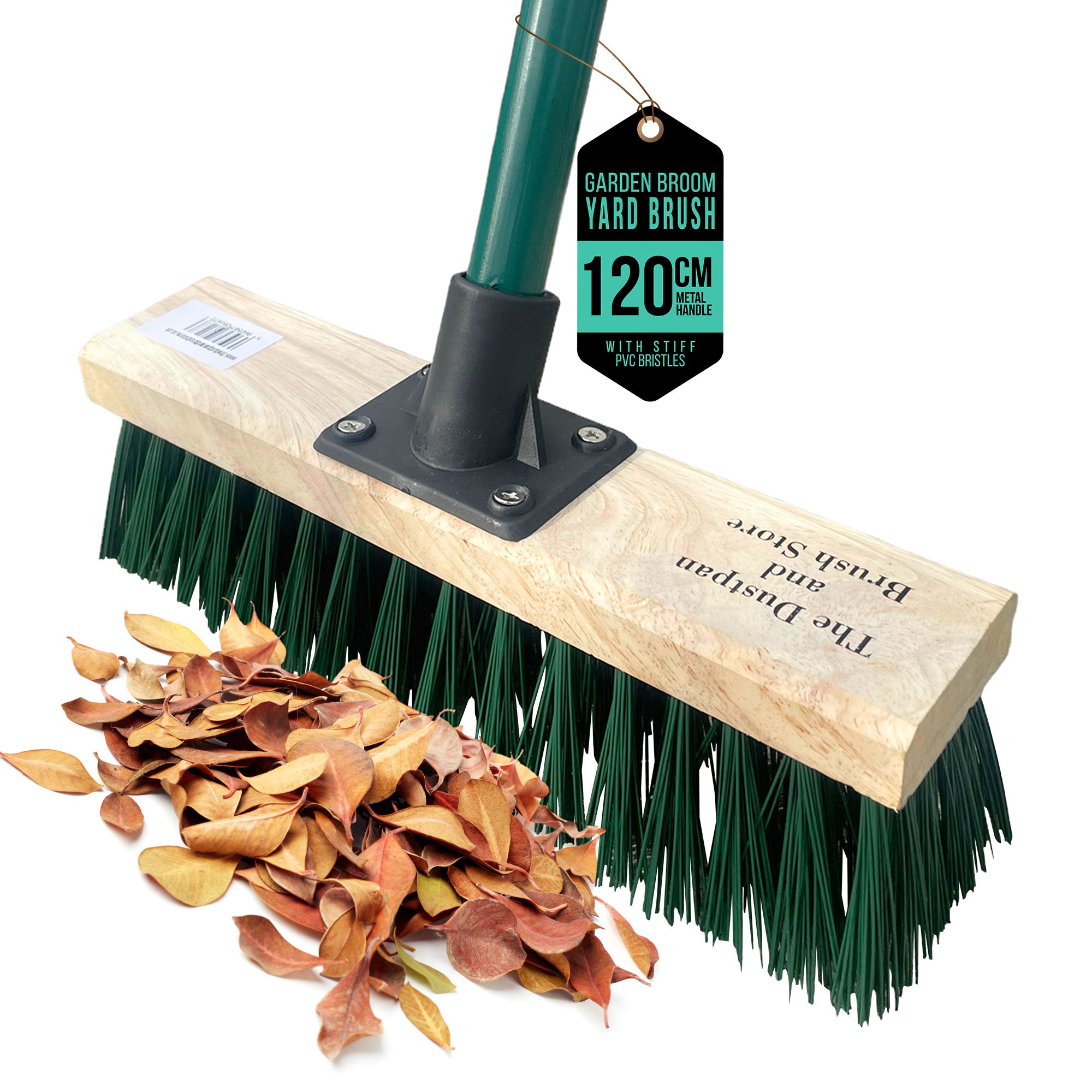 A garden yard broom with a light wood handle, dark green bristles, and a black central connector, shown on a white background with a pile of dry leaves demonstrating its use. A black and green tag on the handle reads 'GARDEN BROOM YARD BRUSH 120 CM WEAK STIFF'.