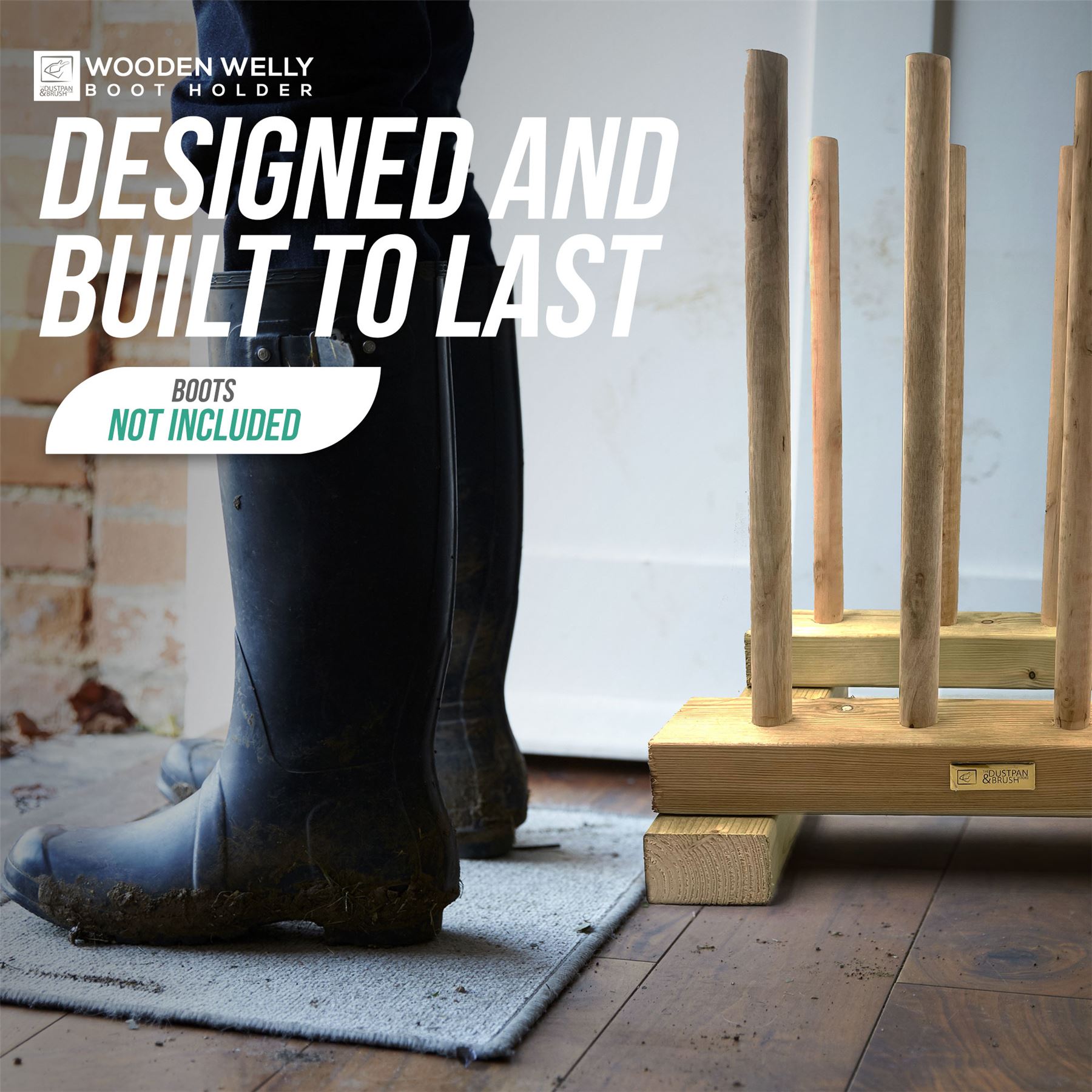 Wooden boot holder with vertical pegs shown beside a person wearing black rain boots on a gray rug over a wooden floor. Large text reads 'DESIGNED AND BUILT TO LAST' and 'BOOTS NOT INCLUDED'; the brand 'WOODEN WELLY BOOT HOLDER' appears in the top left.