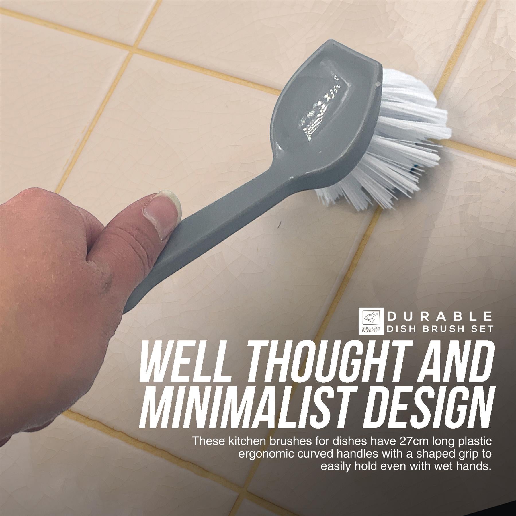 A hand holds a grey kitchen dish brush with white bristles against beige tiled walls. Large text reads 'WELL THOUGHT AND MINIMALIST DESIGN' with smaller descriptive copy below, and a small 'DURABLE DISH BRUSH SET' logo appears on the right.