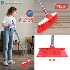 Person using a red sweeping broom with measurements and text on a wooden floor.