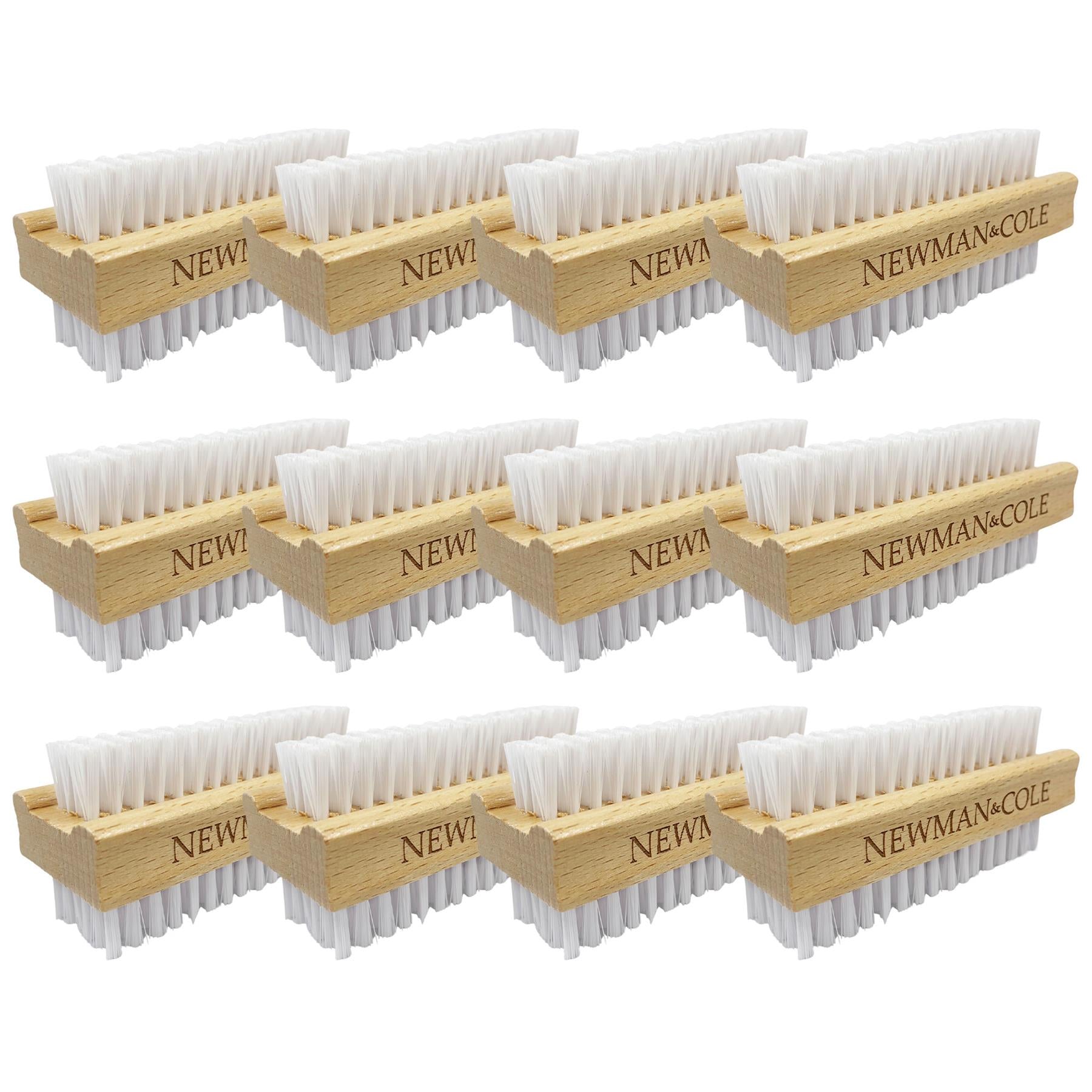 A pack of ten wooden golf club brush holders with white bristles, arranged in a grid on a plain white background. The wooden holders are engraved with 'NEWMAN & COLE'.