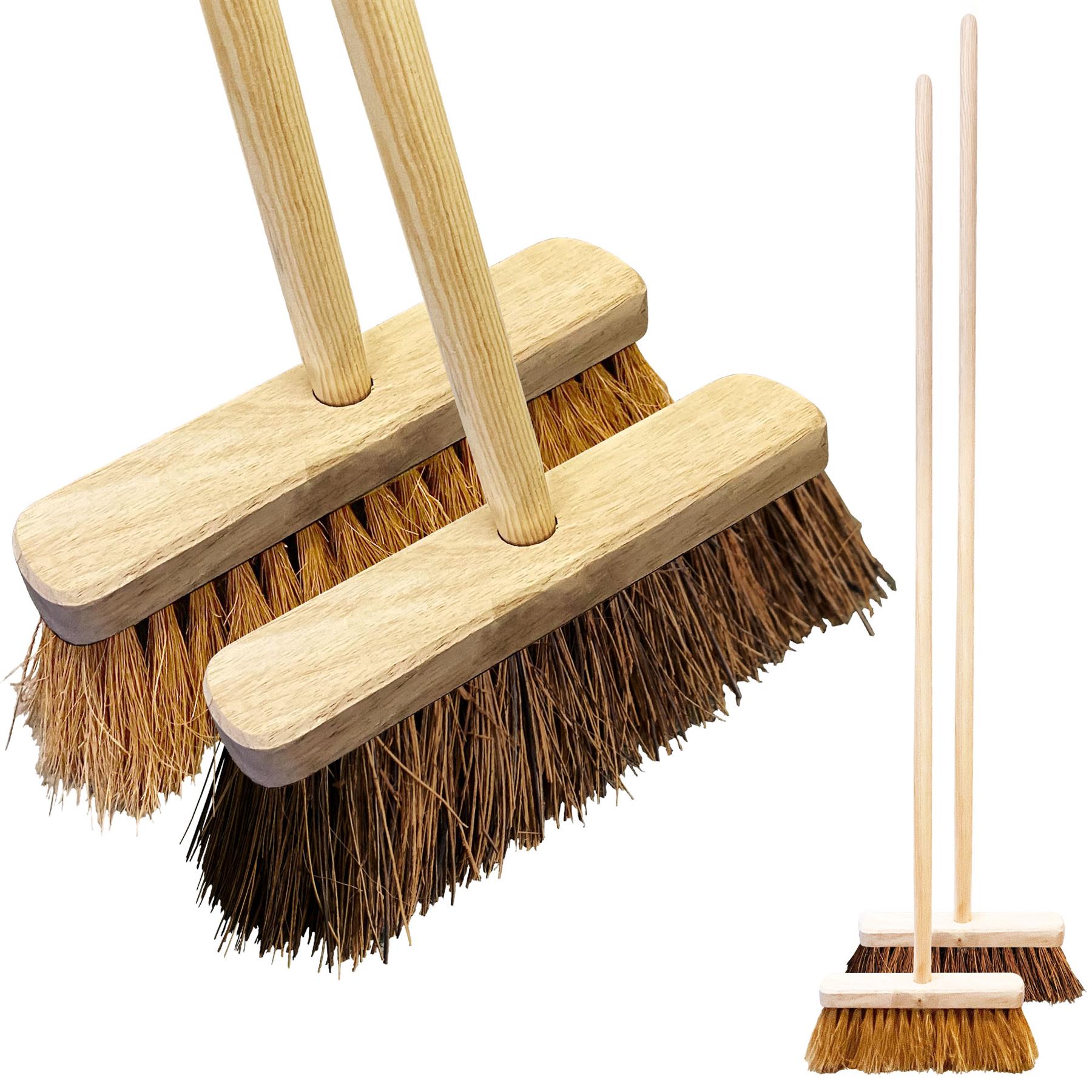 Two brooms with wooden handles and bristle heads on a white background