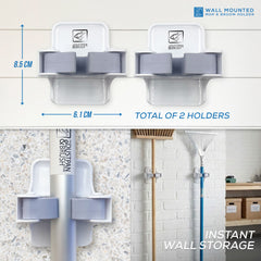 Wall-mounted mop and broom holder with dimensions and instant wall storage text.