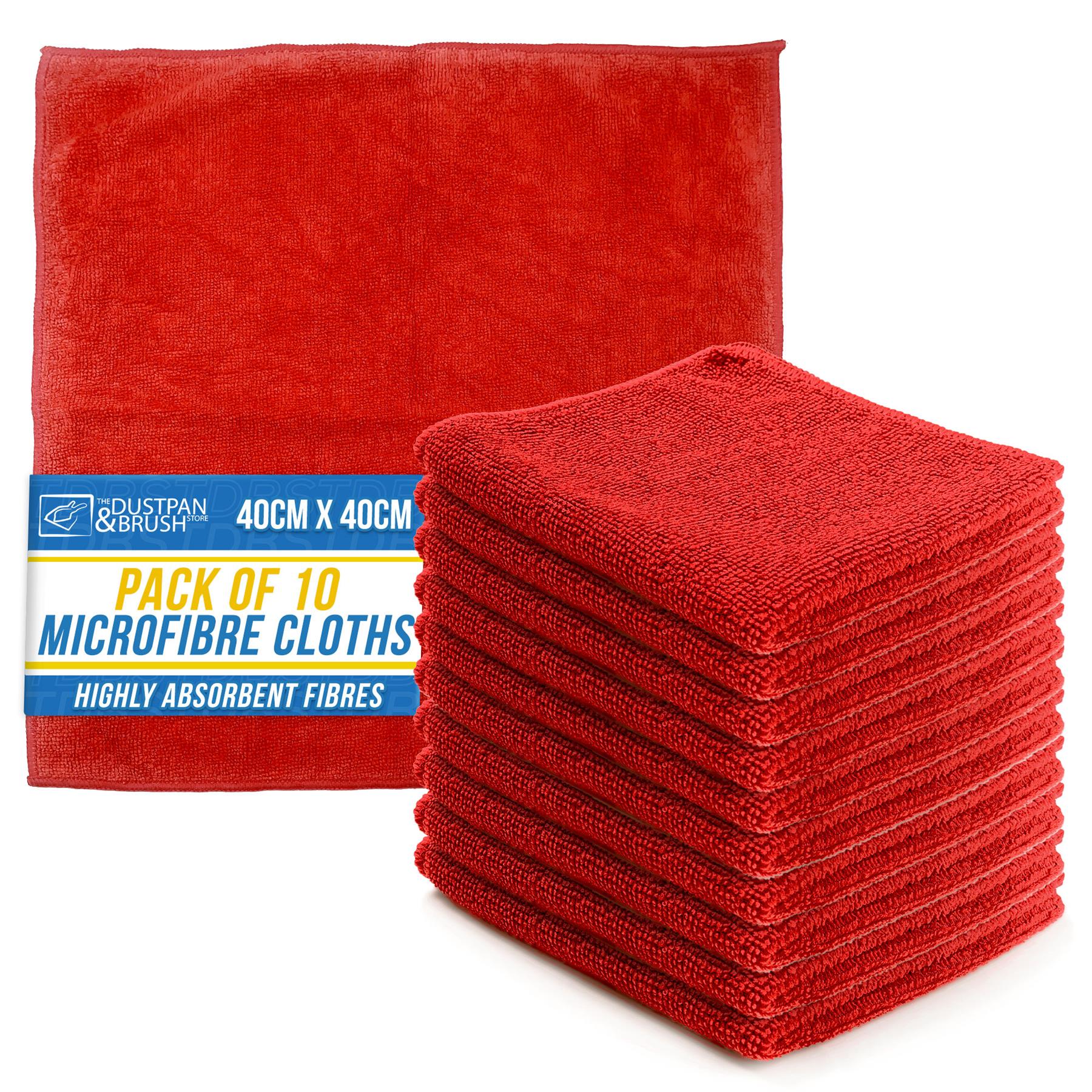 A pack of 10 red microfibre cleaning cloths, with one unfolded cloth showing its texture and a stack of folded cloths in front, next to a blue and yellow product label that reads 'DUSTPAN & BRUSH PACK OF 10 MICROFIBRE CLOTHS 40CM X 40CM'.
