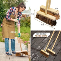 Woman using a broom outdoors with measurements and another broom on a wooden surface.