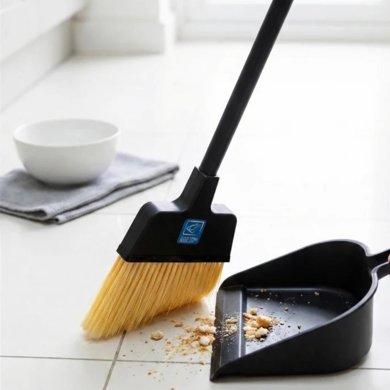 Replacement Stiff Brush for Long Handled Dustpan and Brush Set on a white tiled floor, with crumbs in the dustpan.