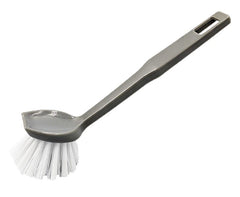 A grey plastic scrubber brush with white bristles, shown diagonally on a plain white background.