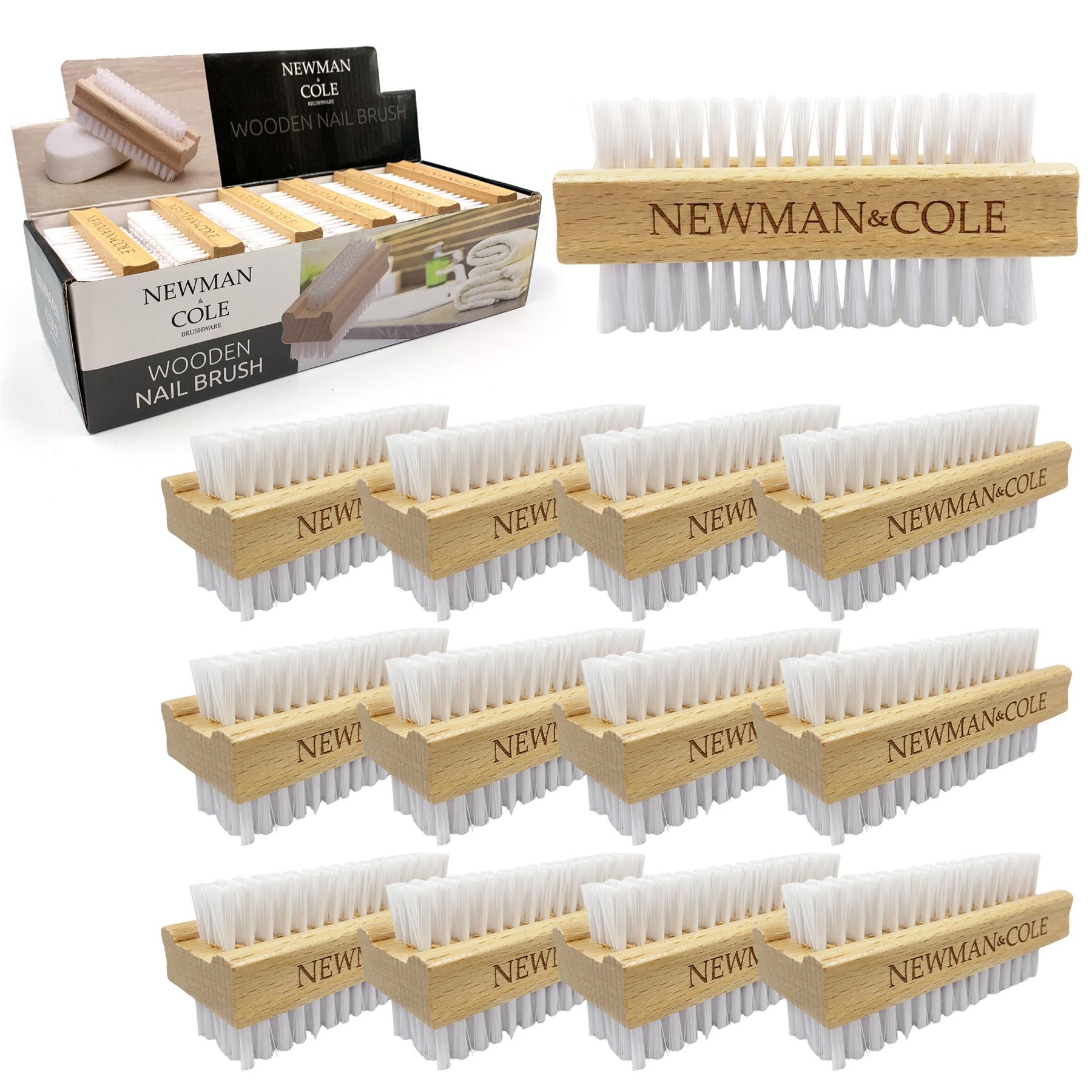 A set of wooden nail brushes arranged on a white background, with one larger brush shown at the top right and multiple smaller identical brushes below. The packaging box for Newman Cole wooden nail brushes is visible at the top left.