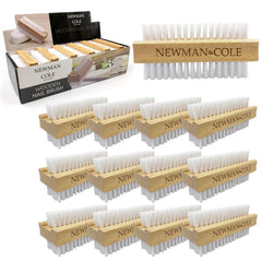 A set of wooden nail brushes arranged on a white background, with one larger brush shown at the top right and multiple smaller identical brushes below. The packaging box for Newman Cole wooden nail brushes is visible at the top left.